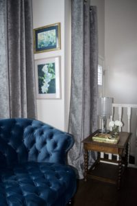 tufted velvet settee and watercolour art