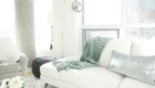 modern scandinavian scandi glam white grey black ivory concrete pillar design swivel chair sectional silver decor living room apartment small space marble table white leather sectional seafoam green pastel soft bright white paint calgary interior designer home by freya maclean pouf ottoman knit arc lamp leather couch corner pillows tassel blanket