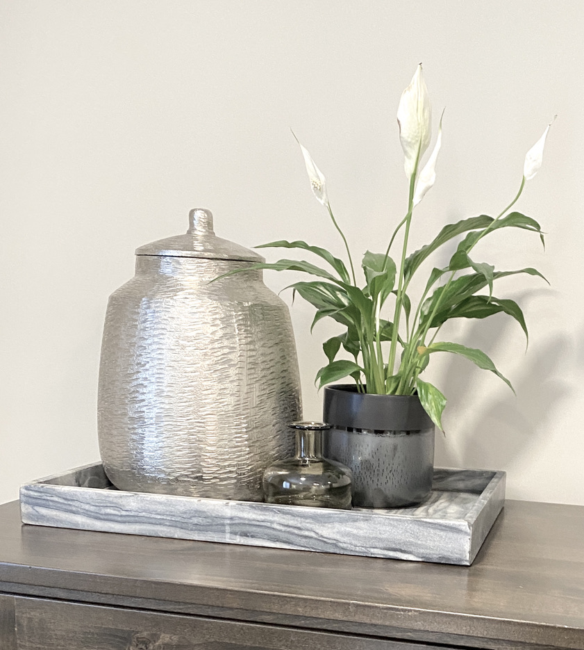 tabletop dresser console shelf styling silver urn grey gray marble tray calla cana lily plant
