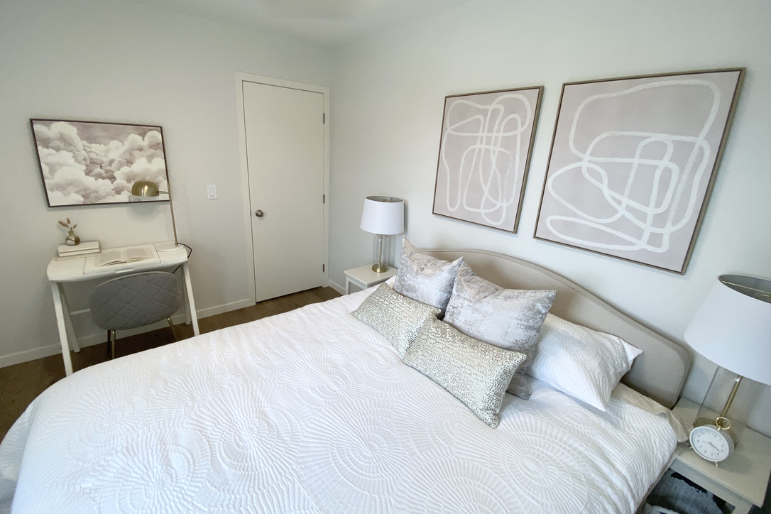 guest bedroom room taupe grey beige tan white ivory desk queen bed small space narrow bedside tables cloud art neutral wall art soft timeless light small space desk vanity paris crate and barrel