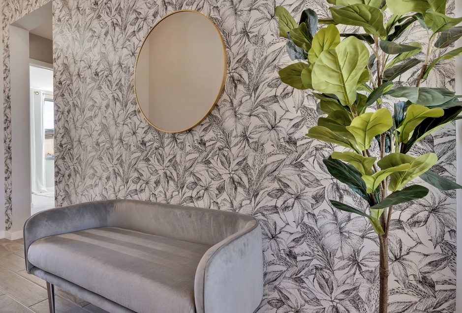 black and white wallpaper wall entry entrance foyer bench plant mirror leaf palm leaves neutral grey gold
