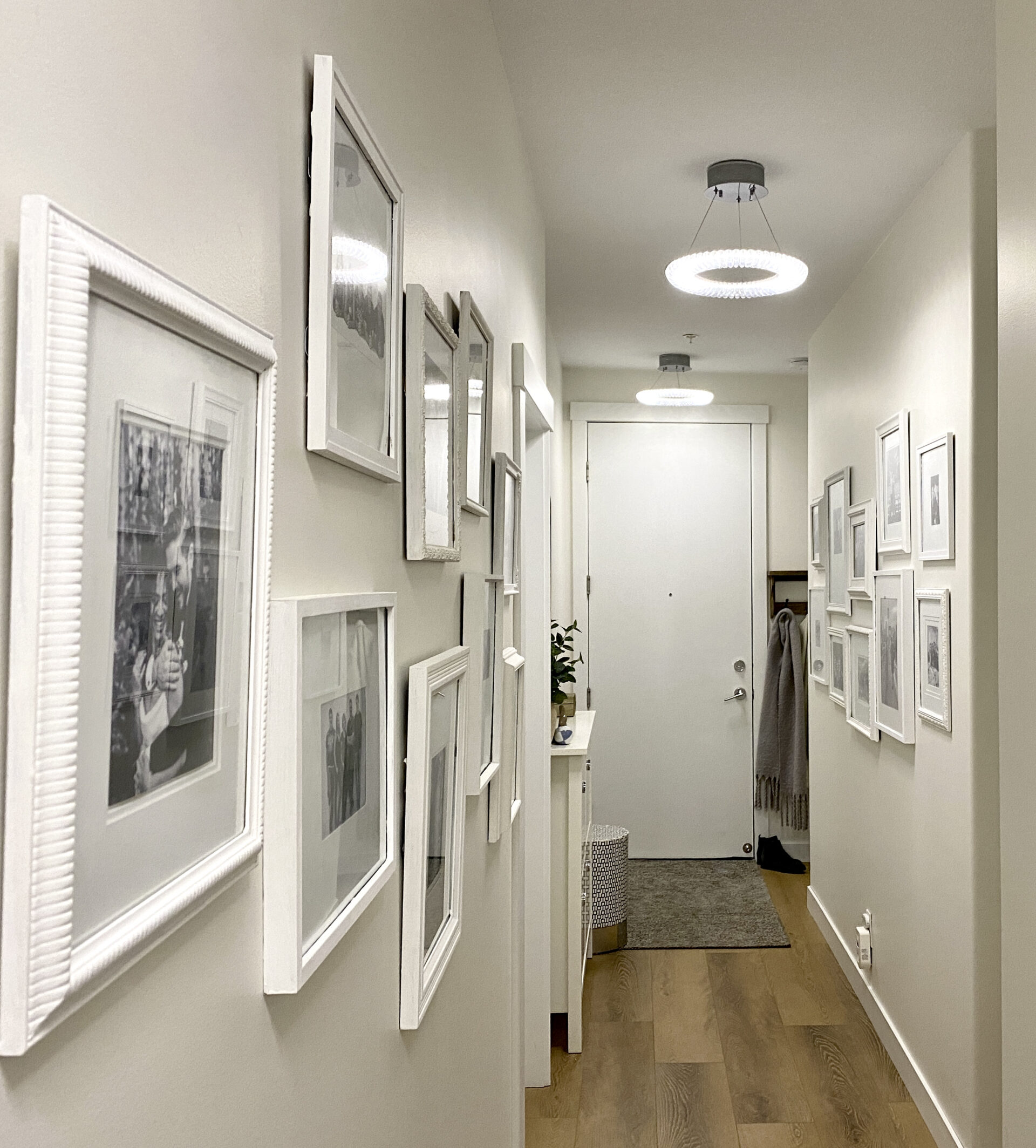 long narrow hallway with gallery wall and storage, hemnes shoe cabinet, antique frames, plastic glass modern classic LED pendant lights, matching pendant lights hallway, small space ideas white dove paint colour walls benjamin moore